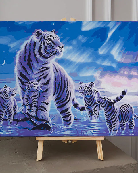 Majestic white tiger with cubs in a glowing moonlit landscape