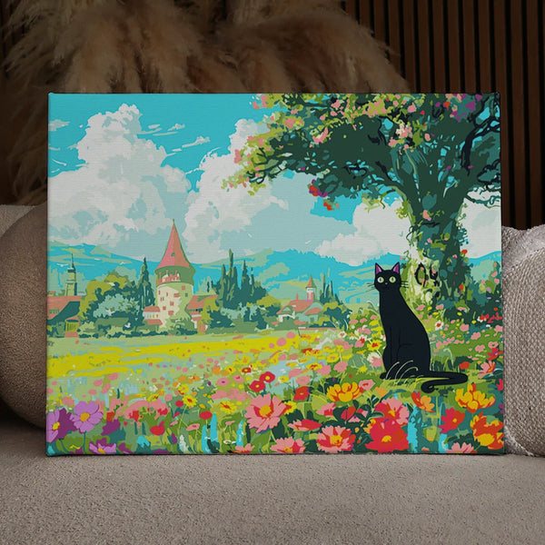 Black cat sitting in a colorful flower field near village