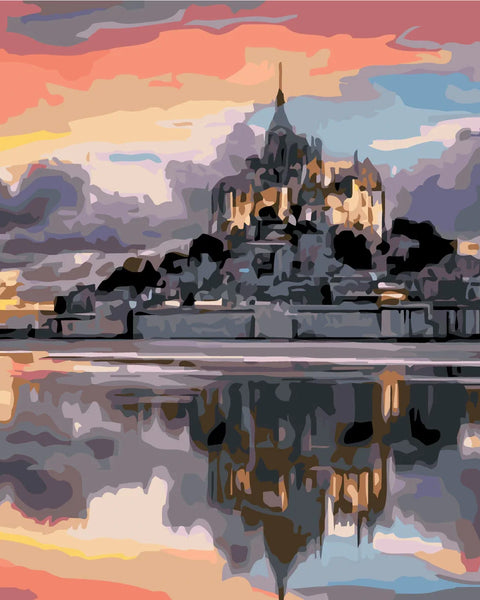 Majestic castle reflecting on water with a colorful sunset sky