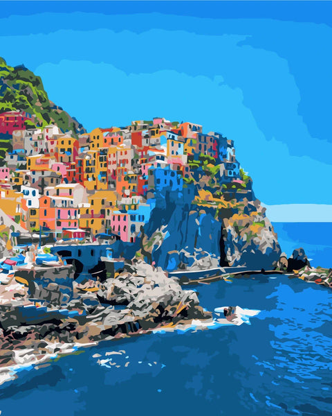 Colorful coastal village on cliffs overlooking the deep blue sea