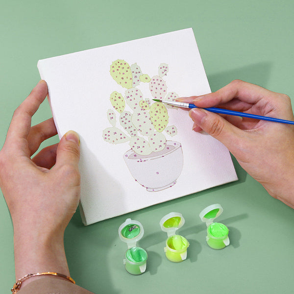 Cactus painting in progress from the Plant Parenthood Paint by Numbers Kit by Artspark, on 6x6 inches (15x15 cm) canvas.