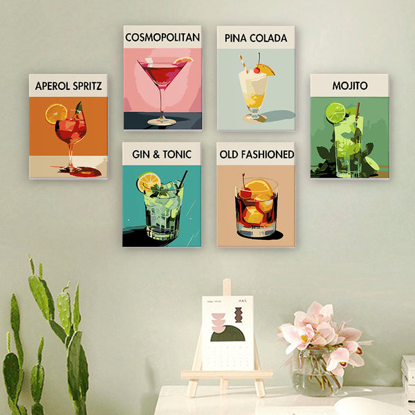 Sip Society cocktail canvas set of 6 paint by numbers displayed on a wall. Includes stylish paintings of iconic cocktails: Aperol Spritz, Cosmopolitan, Pina Colada, Mojito, Gin & Tonic, and Old Fashioned. Perfect decor for cocktail enthusiasts and modern art lovers by Artspark.