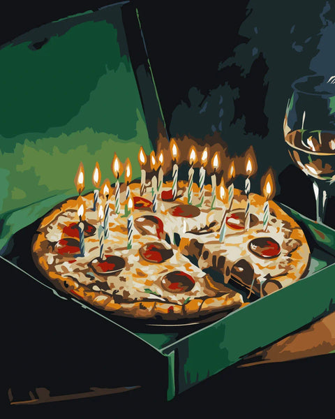 Pepperoni pizza with lit birthday candles in a green box