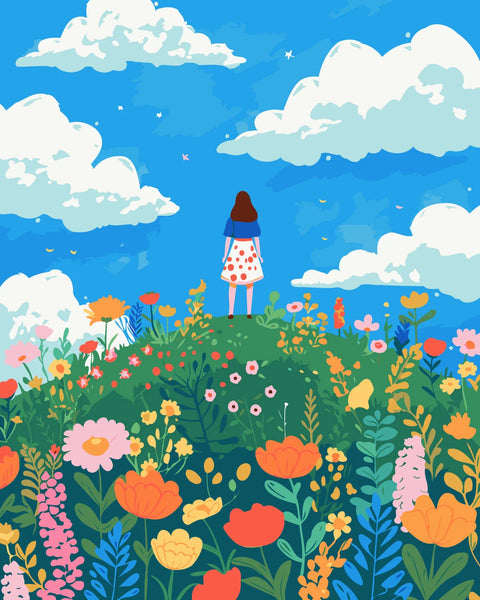 Woman standing on a hill surrounded by colorful wildflowers