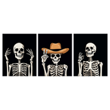 Three skeletons posing, one wearing a cowboy hat, on black background.