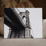 Painting of Brooklyn Bridge from a low-angle perspective in grayscale