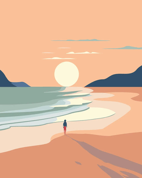 Person walking on a sandy beach towards the sunset over ocean