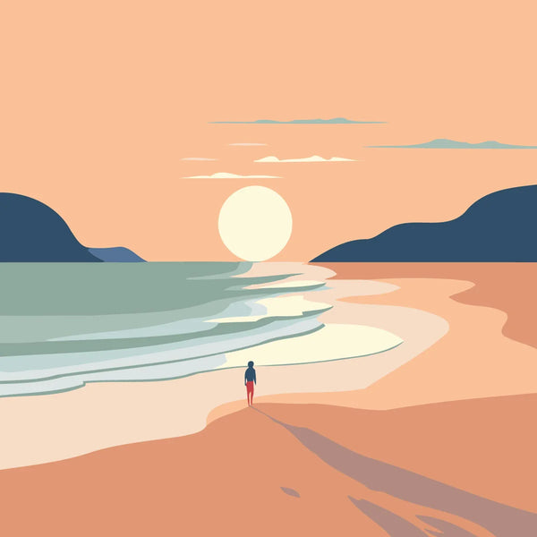 Person walking on a sandy beach towards the sunset over ocean