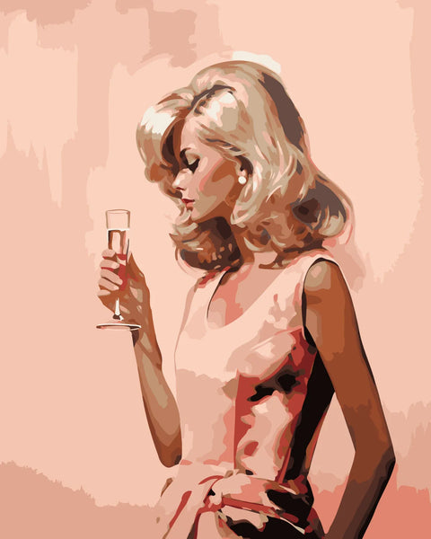 Elegant blonde woman in pink dress holding champagne glass