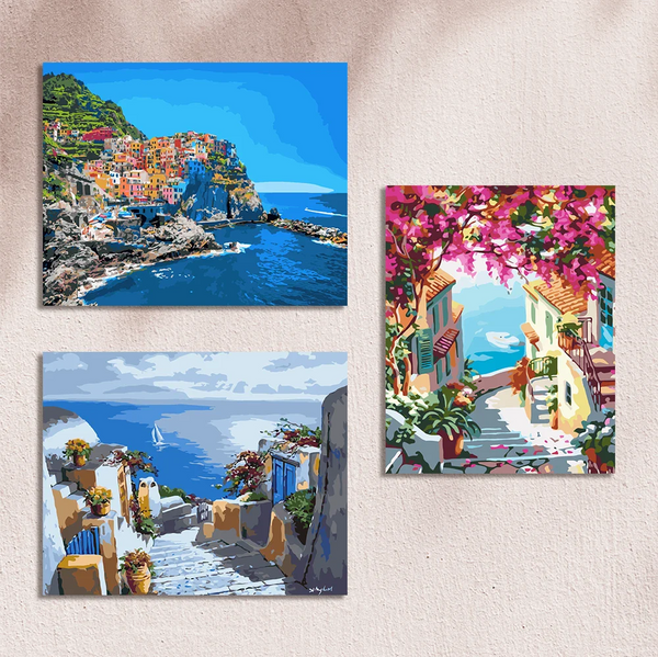 Paintings of colorful coastal villages with ocean views and flowers