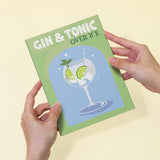 Cocktail Cuties Paint by Numbers Kit by Artspark featuring a fully painted Gin & Tonic canvas held by hands, showcasing the refreshing cocktail design.