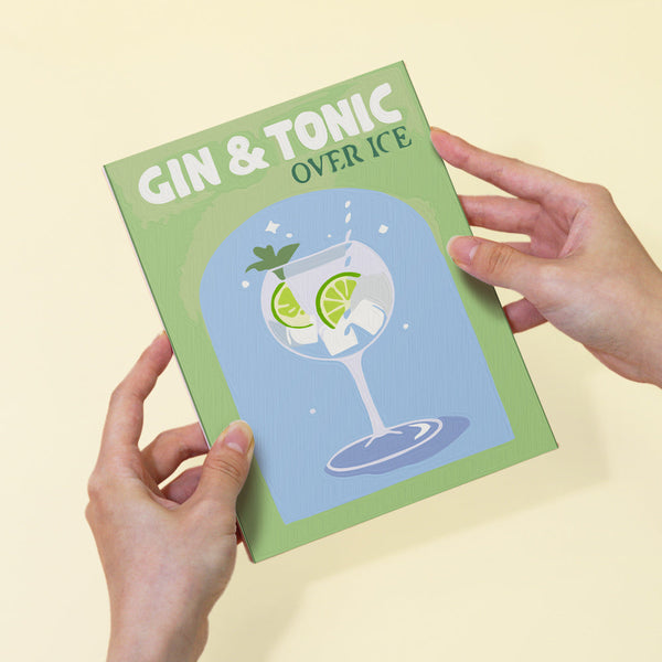 Cocktail Cuties Paint by Numbers Kit by Artspark featuring a fully painted Gin & Tonic canvas held by hands, showcasing the refreshing cocktail design.