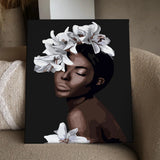 Portrait of a serene woman with white lilies on her head