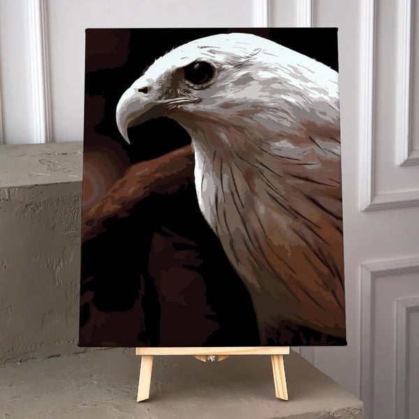 Close-up painting of a majestic white-headed eagle on dark background