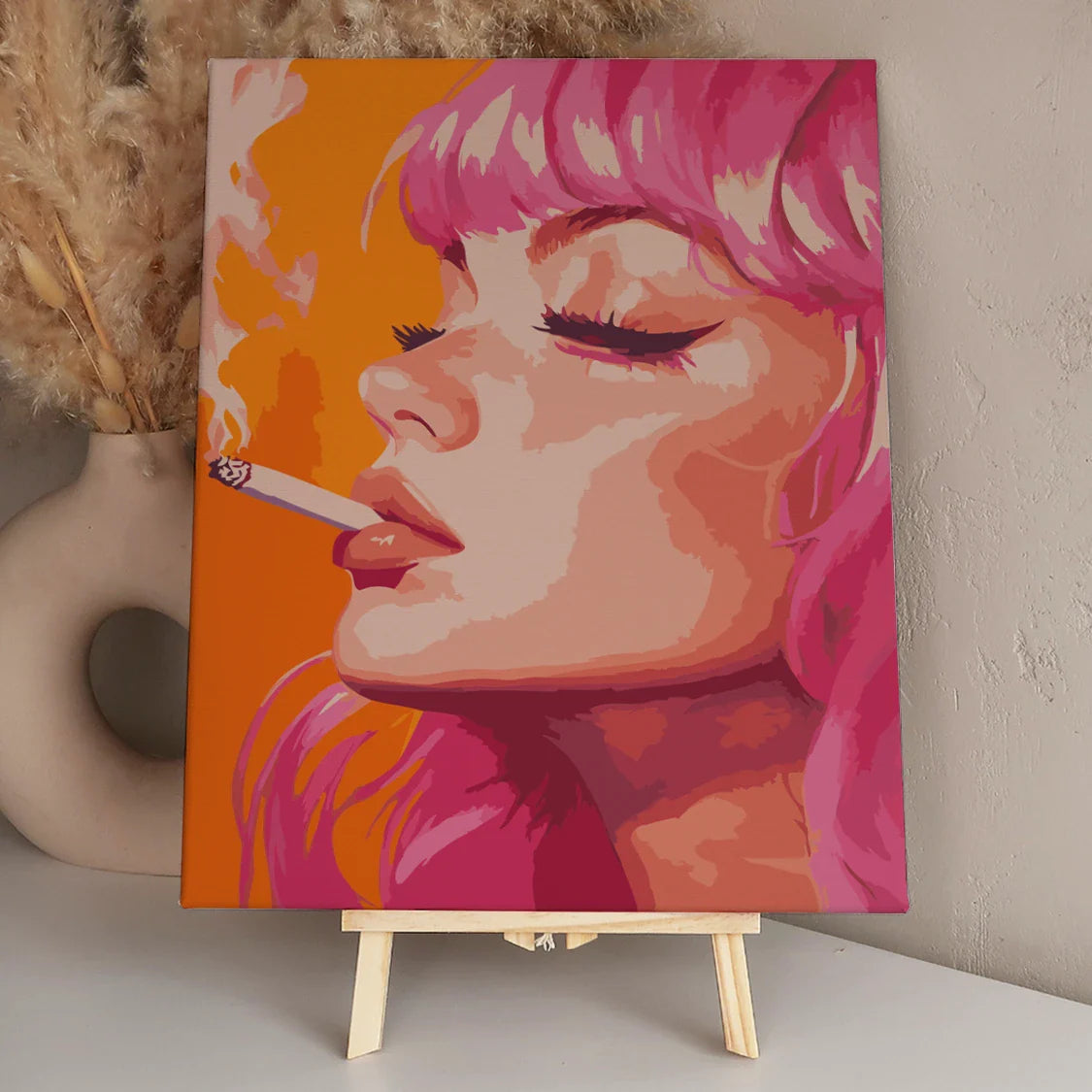 Close-up portrait of a woman with pink hair smoking
