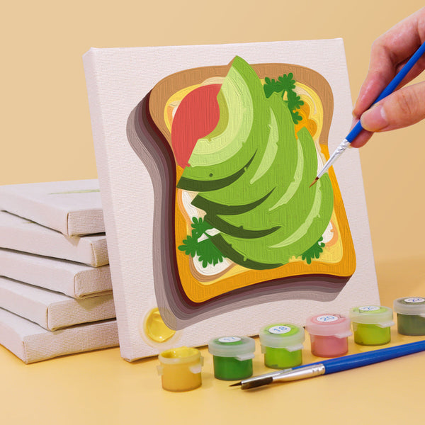 Avocado toast paint by numbers canvas being painted with acrylic paints and brush from the Flavors Around set.