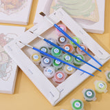 Close-up of paint brushes and numbered acrylic paint pots on a linen canvas from the Flavors Around paint by numbers set.