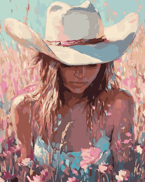 Cowgirl wearing a hat in a colorful wildflower field