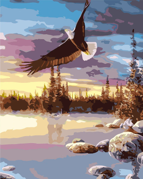 Majestic bald eagle soaring over serene lake at sunset