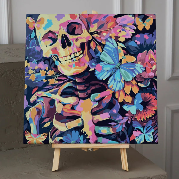 Colorful skeleton surrounded by vibrant flowers and blue butterflies