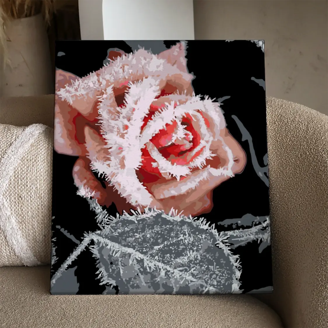 Frost-covered red rose in winter with a dark background