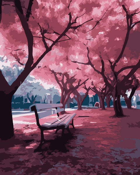 Serene park scene with cherry blossom trees and empty bench