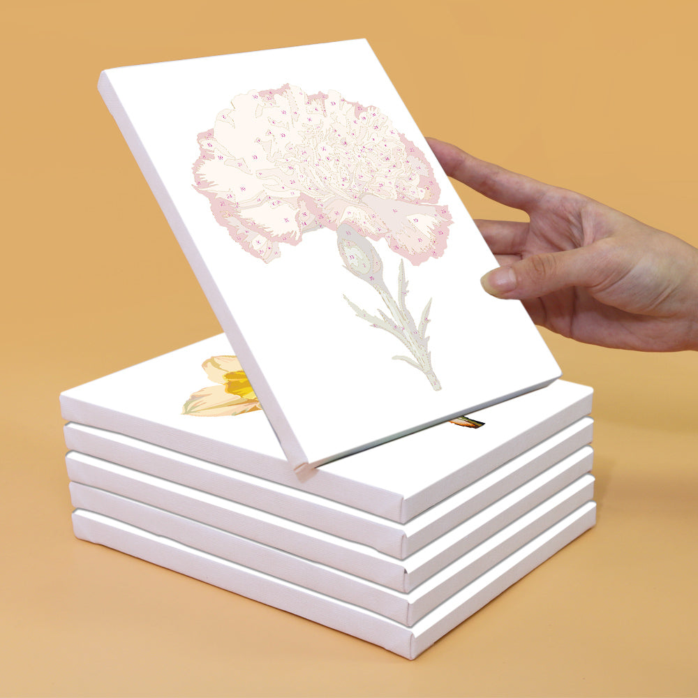 Unpainted canvas featuring a detailed outline of a carnation flower from the Garden Whispers Paint by Numbers Kit. Canvas stacked with others, highlighting the precision and quality of the Artspark kit.
