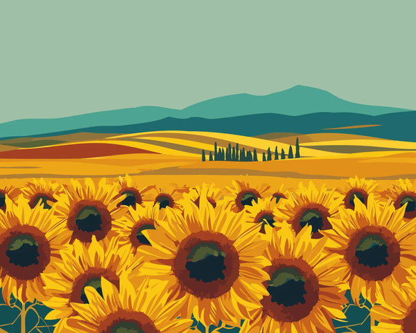 Vibrant sunflower field with rolling hills and mountains in background
