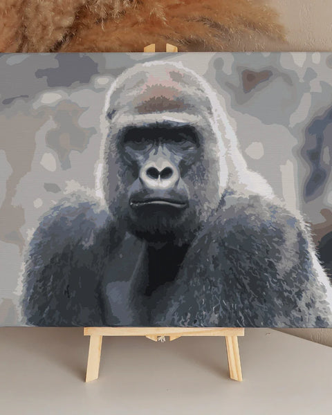 Painting of a gorilla with intense gaze in muted colors.