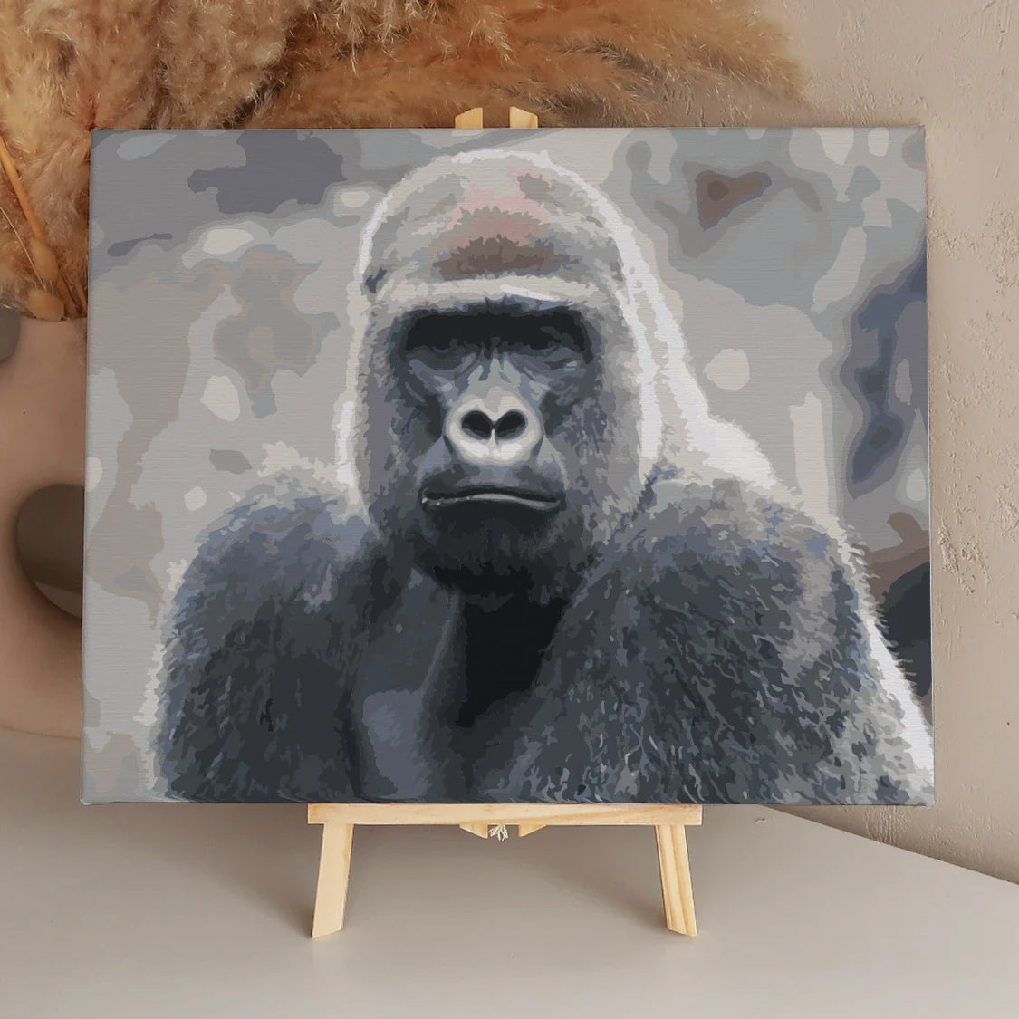 Painting of a gorilla with intense gaze in muted colors.