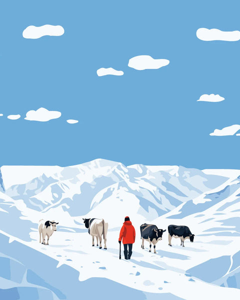 Shepherd guiding cows through snowy mountain landscape under blue sky