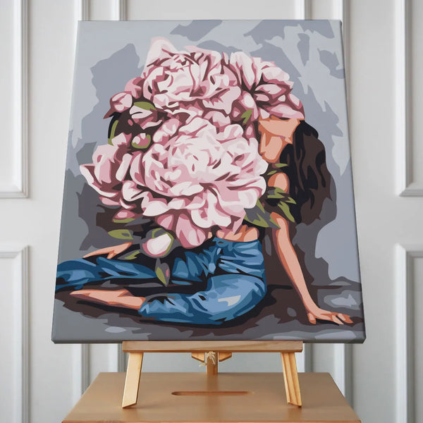 Woman with oversized blooming peonies covering her head and body
