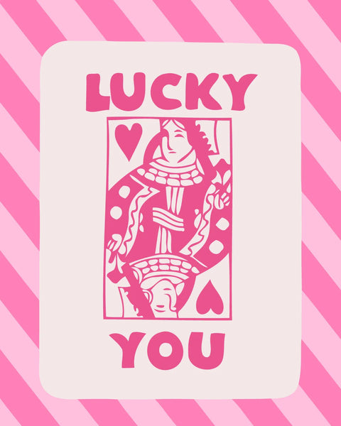 Pink queen of hearts playing card with "Lucky You" text