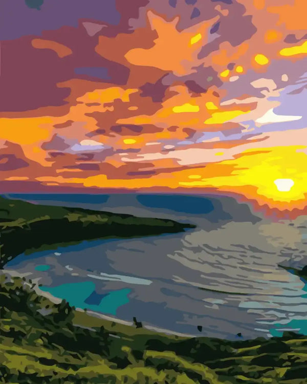 Vibrant sunset over an ocean bay with lush green hills