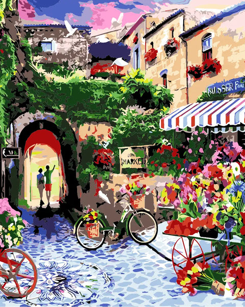 Colorful European street market with flowers, bicycles, and historic buildings