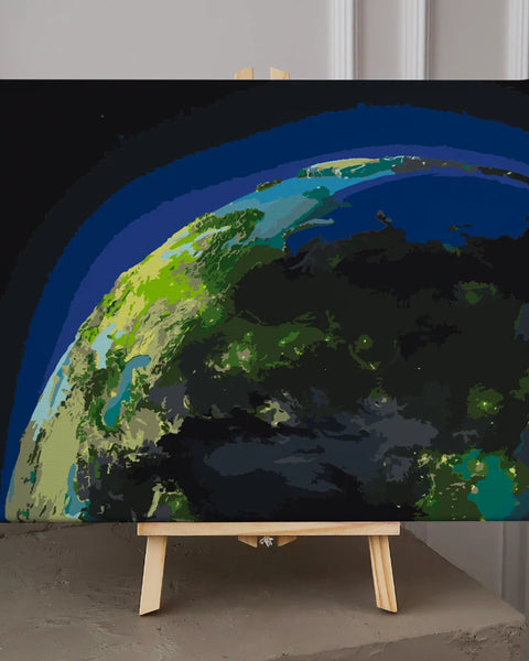 Earth from space with glowing lights and atmospheric blue halo