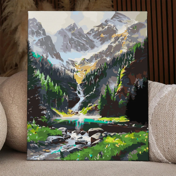 Majestic mountain landscape with a waterfall flowing into a lake