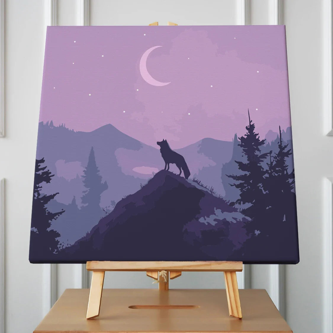 A lone wolf stands atop a mountain peak, silhouetted against a crescent moon and starry night sky, surrounded by misty purple mountains and pine trees.