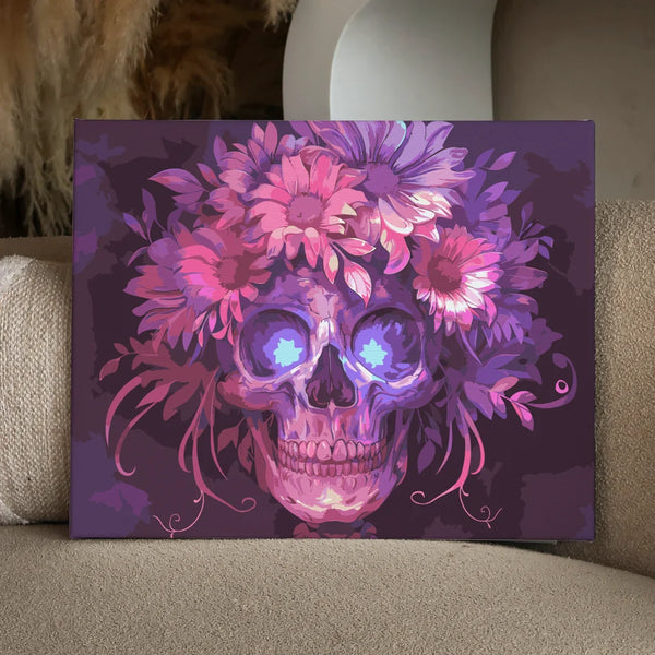 Colorful skull adorned with vibrant flowers on a dark background