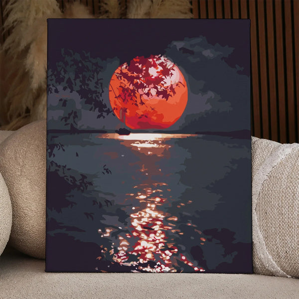 Sailboat on water with glowing red sunset and tree silhouette painting