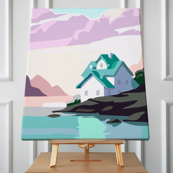 Cozy house on rocky seaside with pastel sky and mountains painting