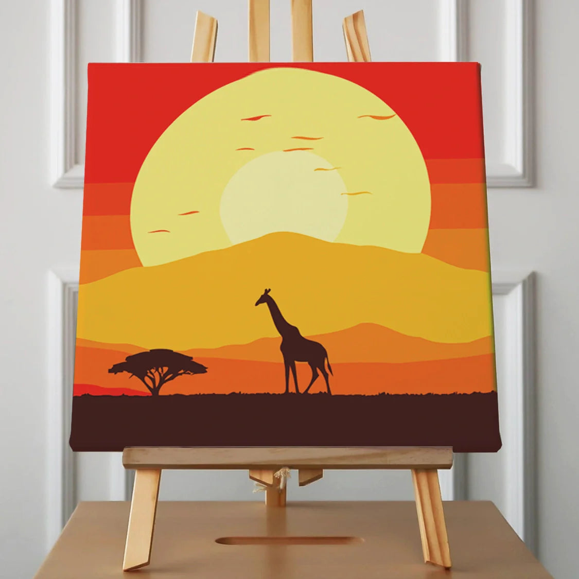 Silhouette of a giraffe in an African sunset savanna scene