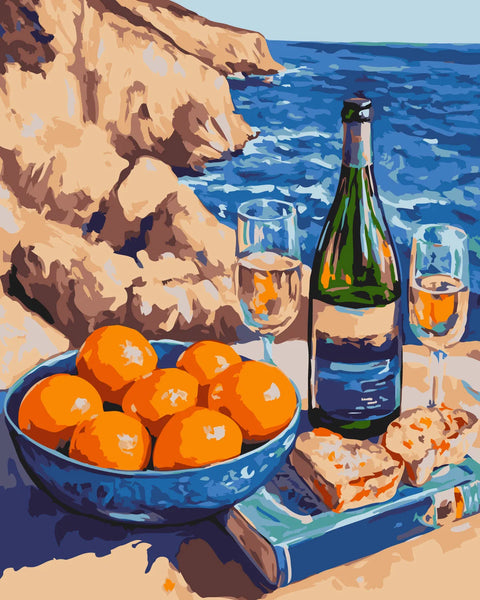 Still life of wine, oranges, and bread by the sea