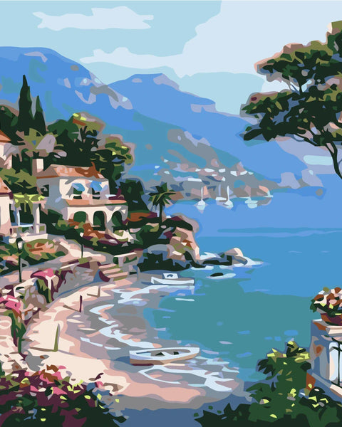 Coastal village painting with seaside villas, blue water, and boats