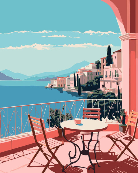 Scenic coastal terrace with chairs overlooking a Mediterranean village