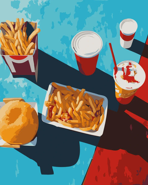 Fast food meal with fries burger and drinks on colorful table