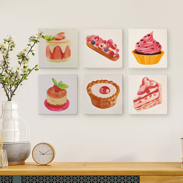 Sugar & Whimsy Paint by Numbers Kit by Artspark with six dessert canvases displayed on a wall.