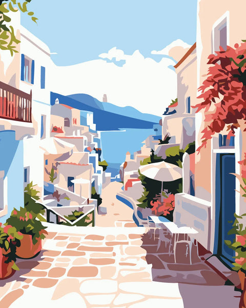 Colorful Mediterranean village street with ocean view and vibrant flowers