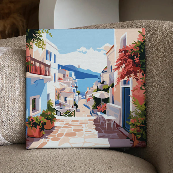 Colorful Mediterranean village street with ocean view and vibrant flowers