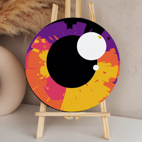 Painting of a colorful abstract eye with vibrant splashes of color